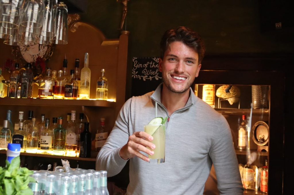 Jack holding a cocktail 